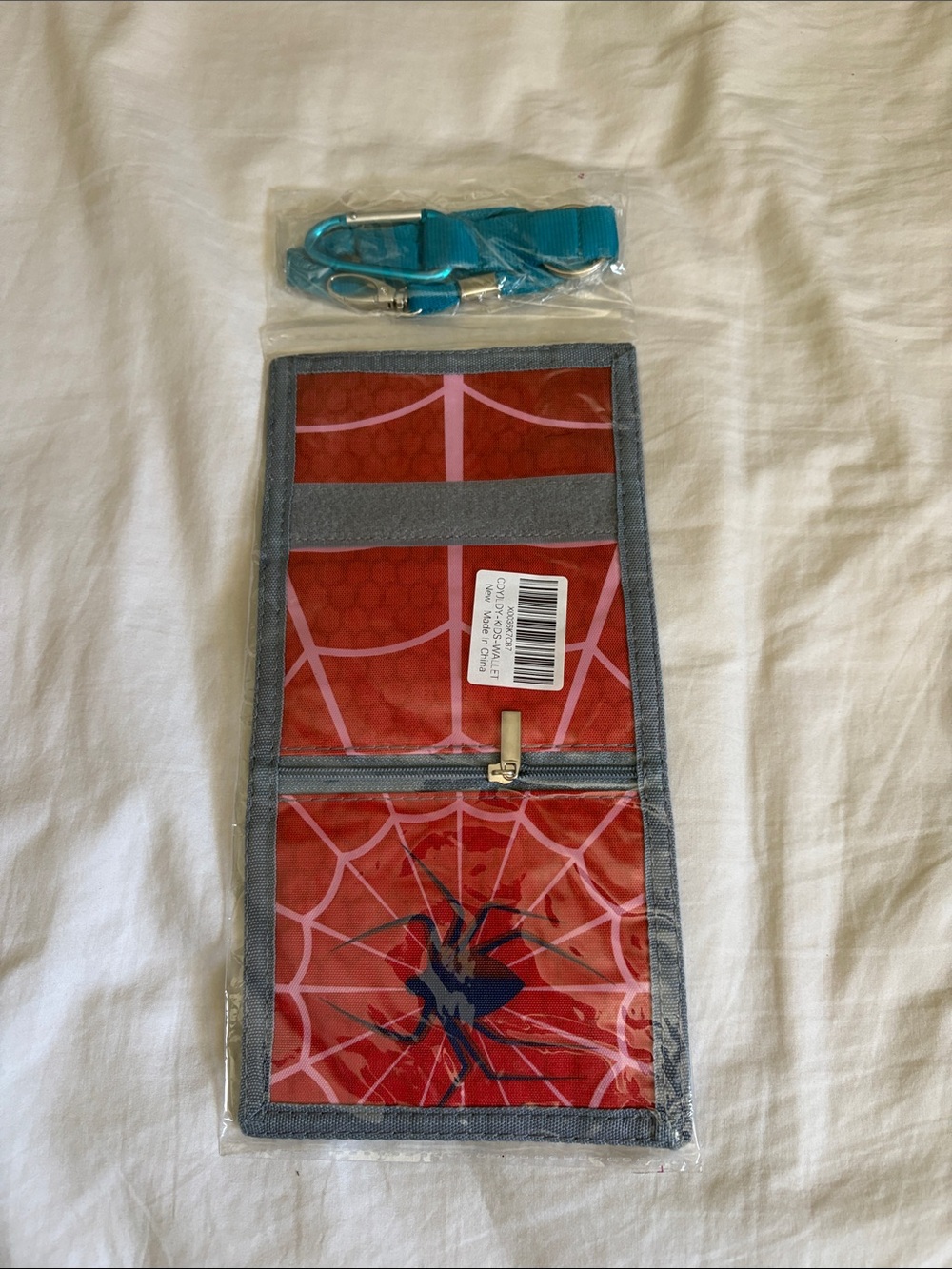 Red Spider Web Travel Wallet with Teal Strap